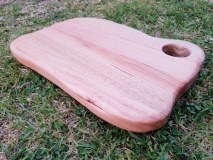 This rustic edge chopping board is a delight to handle and use in your kitchen, smooth Vic Ash with a hole for easy lifting, the unique shape comes in handy during use, it\'s been designed and made by hand with that in mind.Feel the smooth curves! I spend a lot of time shaping these and sanding until it\'s truly smooth, finished with an all natural food-safe counter top oil blend.