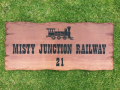 Garden sign engraved train picture and house number