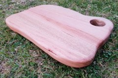 This rustic edge chopping board is a delight to handle and use in your kitchen, smooth Vic Ash with a hole for easy lifting, the unique shape comes in handy during use, it\'s been designed and made by hand with that in mind.Feel the smooth curves! I spend a lot of time shaping these and sanding until it\'s truly smooth, finished with an all natural food-safe counter top oil blend.