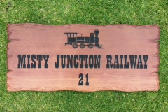 Garden sign engraved train picture and house number