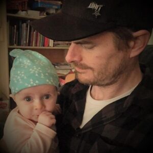 Photo of Andrew Wilkerson holding baby daughter Elly-May Wilkerson
