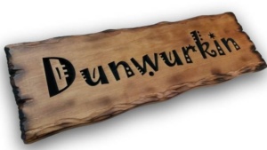 flame burnt Cedar sign for a novel retirement gift - sign reads Dunwurkin