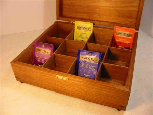 Photo of a Tea Box with the lid open. Tasmanian Blackwood. Brass catch. To suit Twinings tea sachets with dividers.