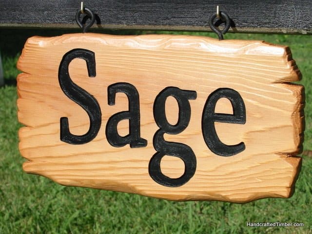 Close up of wooden name sign for dog kennel