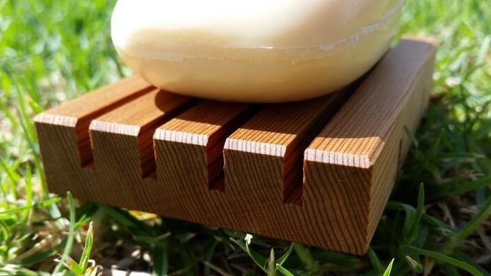 Photo close up of wooden soap on holder. Soap not included.