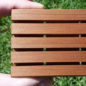 close up of wooden soap holder drain holes