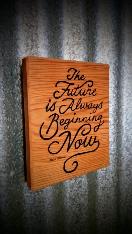 an example of an engraved wooden plaque made from cedar with engraved and painted text quote and magnet on back for hanging