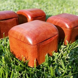 closeup of tiny wooden boxes suitable for a ring box