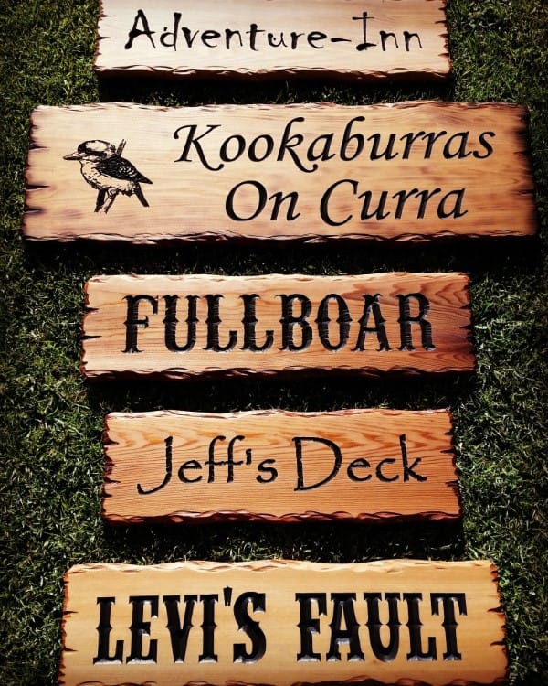 rustic timber signs scorched with flame