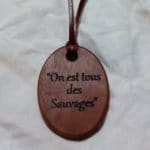handmade pendant necklace crafted from jarrah with fine kangaroo leather strap engraved with text 