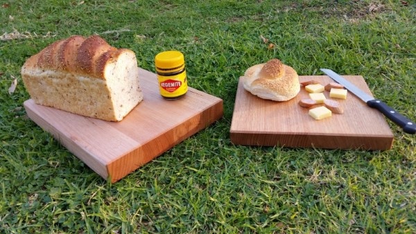 chopping boards on grass with bread cheese cabana and cutting knife