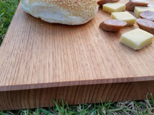 smaller cutting board with cheese knife and cabana