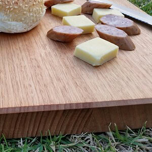 smaller cutting board with cheese knife and cabana