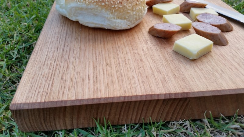 smaller cutting board with cheese knife and cabana