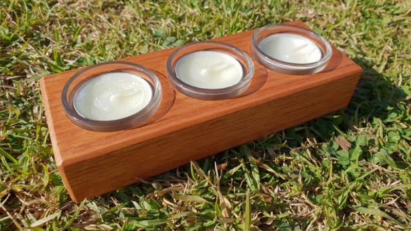 tealight candle holder with glass inserts Australian timber angle shot on grass