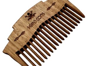hand crafted wooden beard comb closeup image on white background