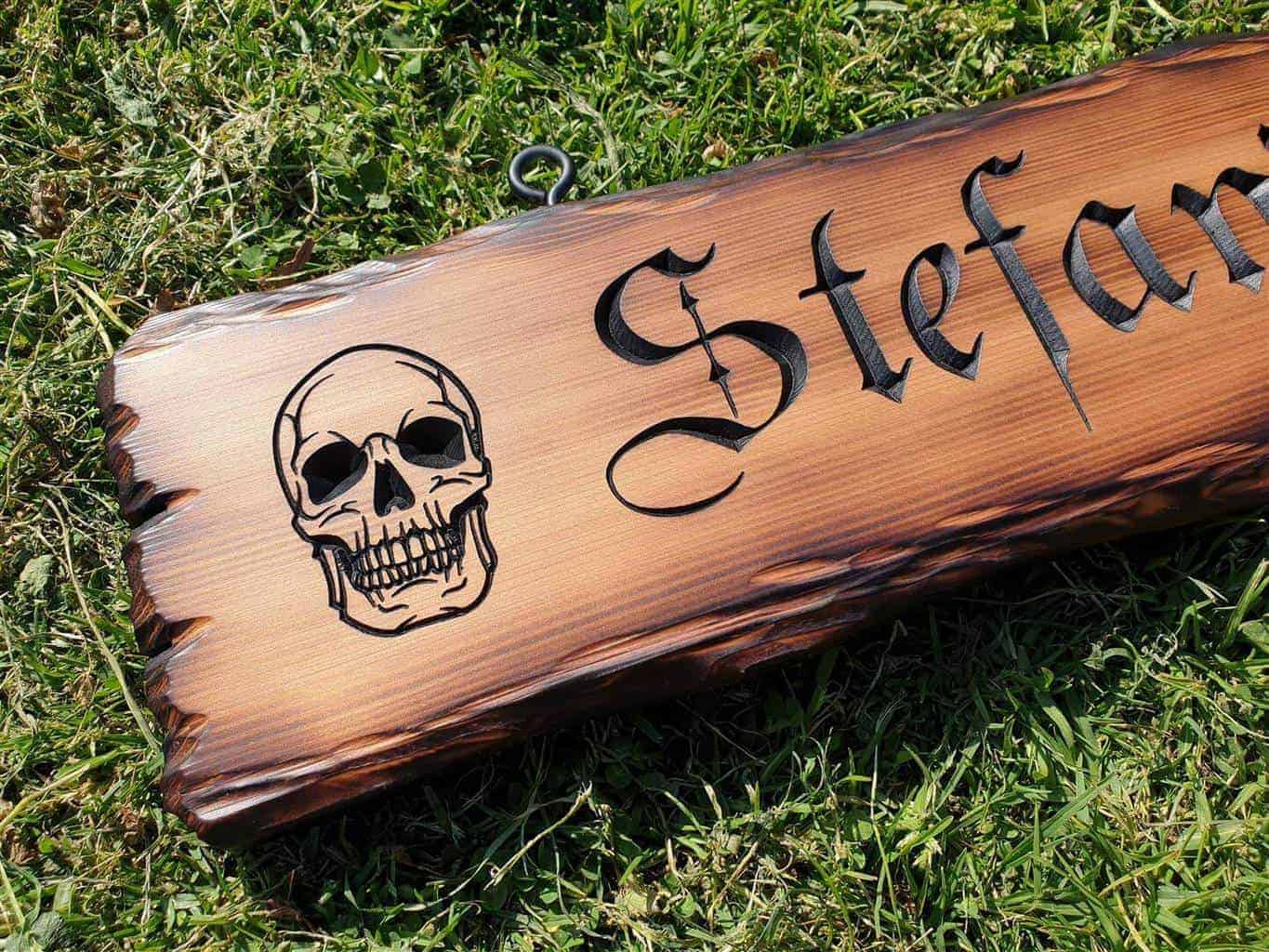 engraved skull wooden bar sign