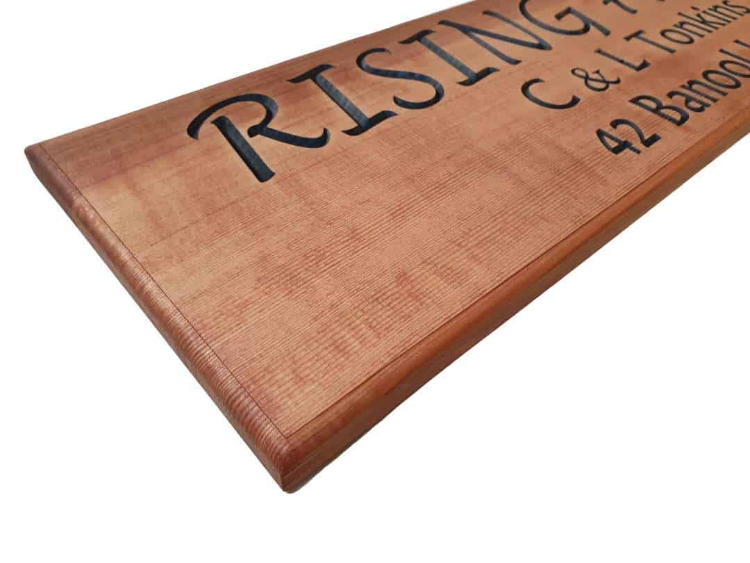 cedar sign with routed edge profile