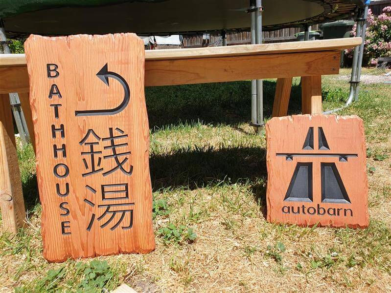 Cedar signs directional rustic edge for Japanese bathhouse and Autobarn shed sign