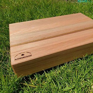 Tasmanian Oak Chopping Board sitting on grass
