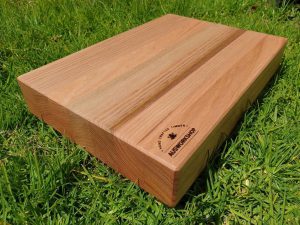 Custom Made Tasmanian Oak Chopping Board sitting on the grass in the sun