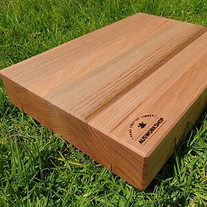 Custom Made Tasmanian Oak Chopping Board sitting on the grass in the sun