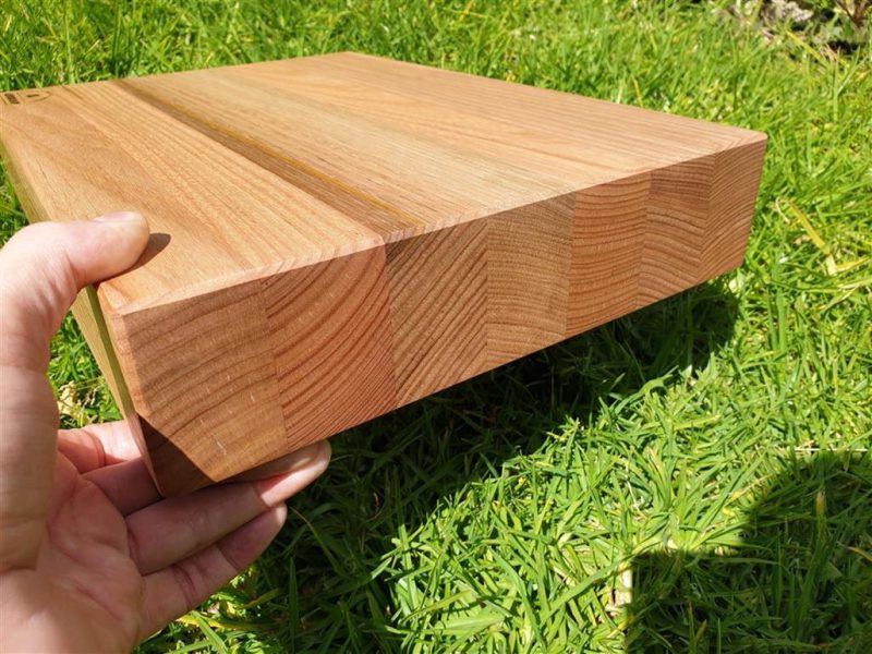Tasmanian Oak chopping board lifted up to show thickness of timber
