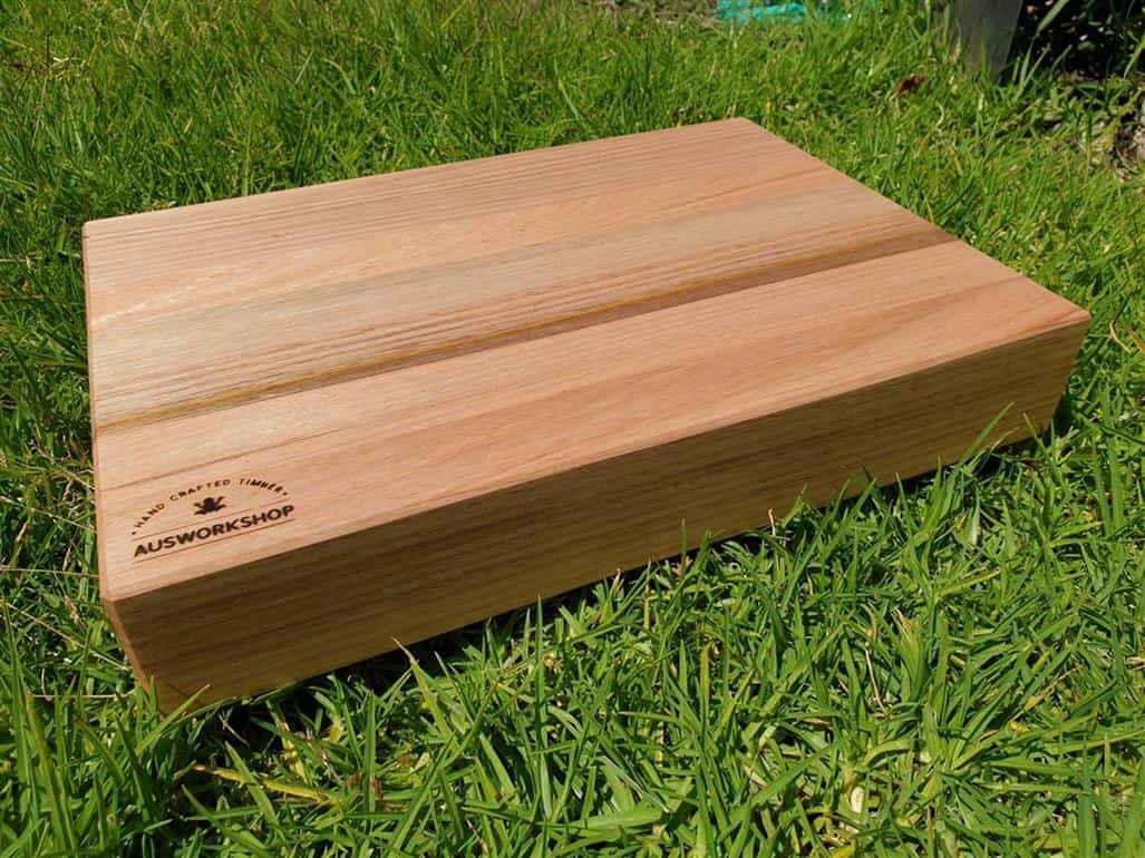 Tasmanian Oak Chopping Board sitting on grass