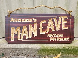 man cave sign personalised Andrews my cave my rules on front of shed with hemp rope and mahogany stain