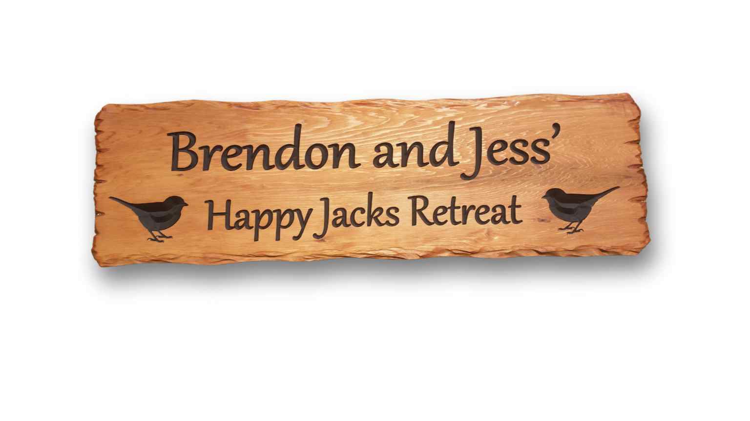 house sign outdoors Happy Jacks Retreat with bird pictures engraved Cedar sign with rustic edges