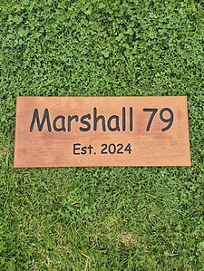 house name sign showing established date wooden carved out lettering painted black with quality outdoor decking oil finish