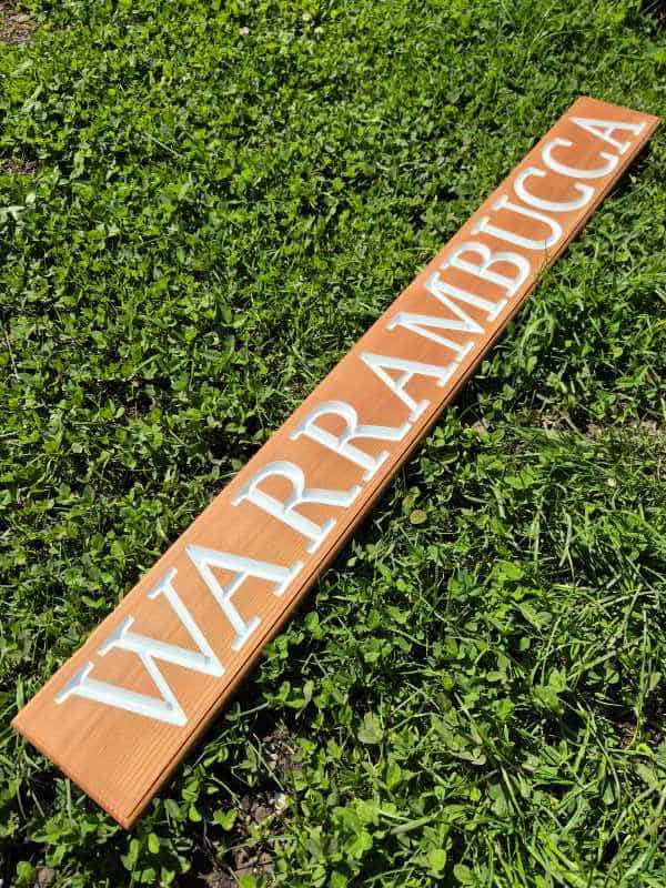 house sign made from quality western red cedar with high visibility white lettering carved then painted wooden sign with dulux enamel