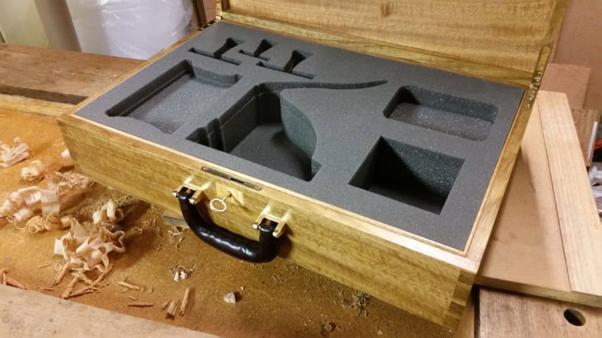 custom made wooden box on the workbench with wood shavings in the background