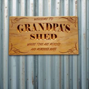 Grandpa's Shed handcrafted wooden sign mounted on shed wall