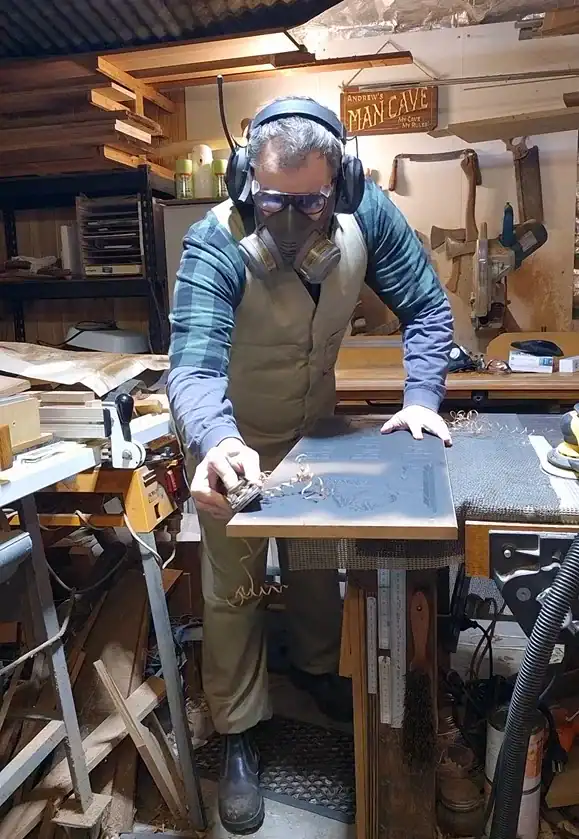 Andrew hand planing timber in the AusWorkshop woodworking workshop